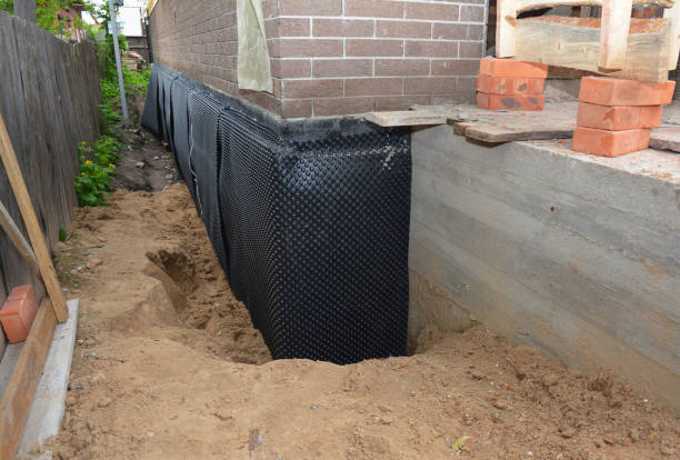 Happy homeowners after waterproofing job in Porterfield